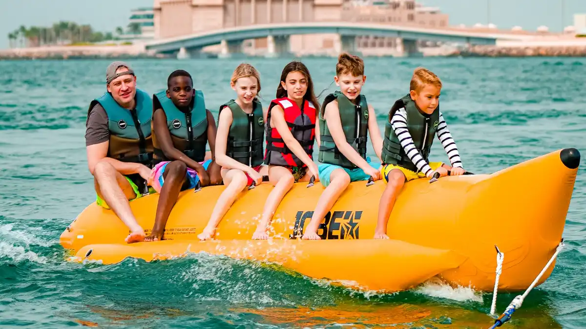 Equipment and safety of participants before starting banana boating in Dubai